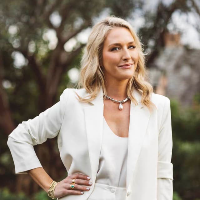 woman in white outfit smiling